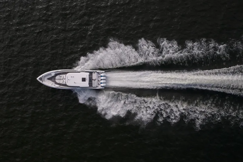 Slide: The Image of Aerial view of 2026 Fountain 43 SCX speedboat cutting through water. - 7