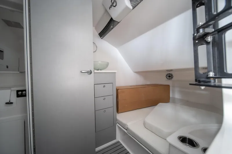 Slide: The Image of Interior of 2026 Fountain 43 SCX boat cabin with seating and storage. - 8
