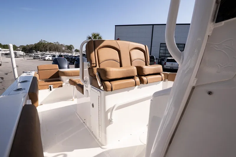 Slide: The Image of 2021 Sea Hunt Gamefish 27 Coffin Box boat interior with tan seating and modern design. - 11