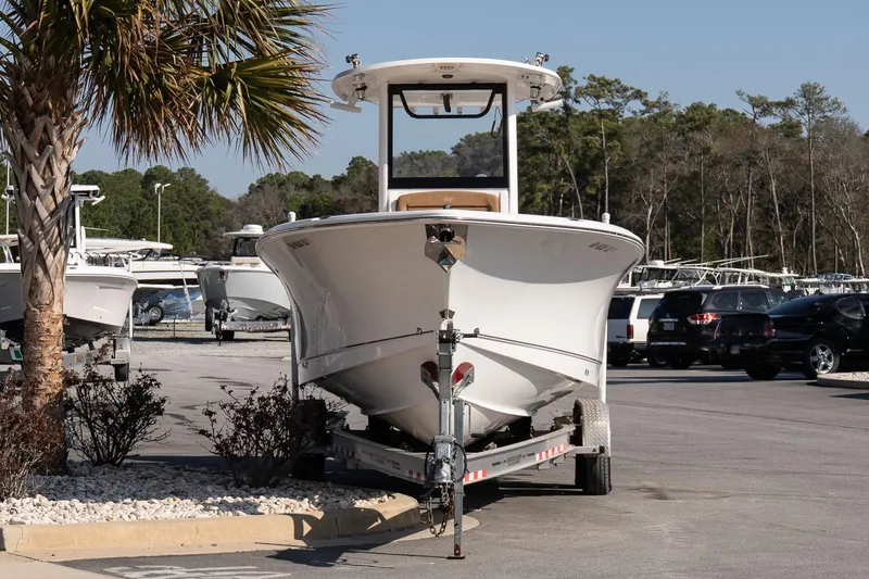 Slide: The Image of 2021 Sea Hunt Gamefish 27 Coffin Box boat on trailer in parking lot. - 3