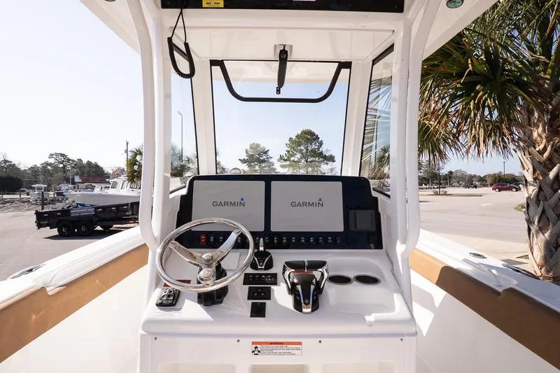 Slide: The Image of 2021 Sea Hunt Gamefish 27 Coffin Box boat dashboard with Garmin navigation system. - 8