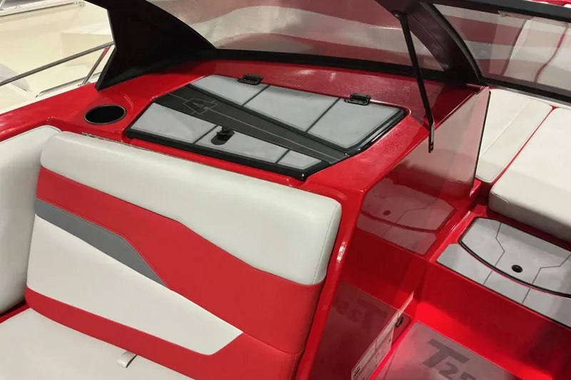 Slide: The Image of 2022 Axis T250 boat interior with red and white seating and storage compartments. - 12