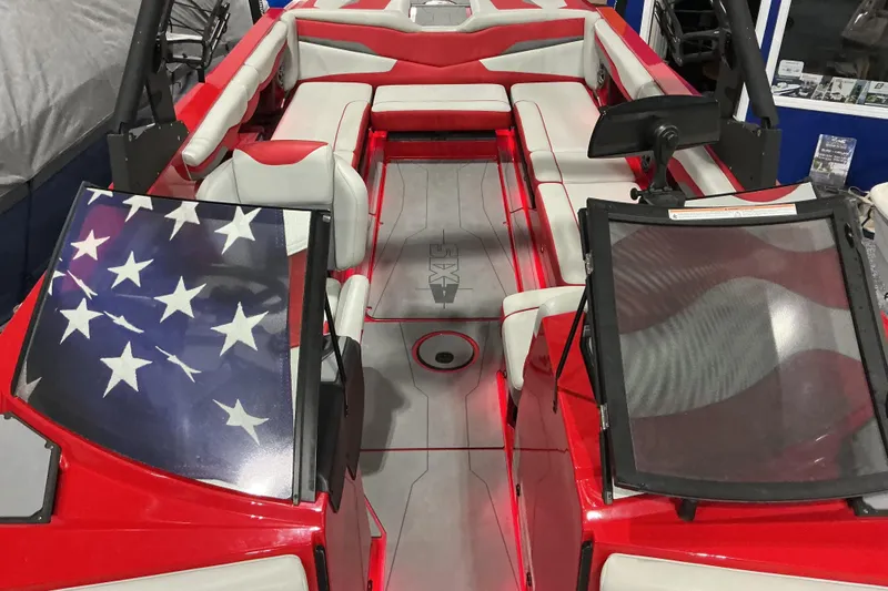 Slide: The Image of Red and white 2022 Axis T250 boat interior with American flag design on windshield. - 13