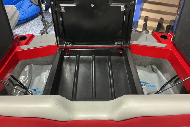 Slide: The Image of Open storage compartment of 2022 Axis T250 boat, showcasing interior space and design. - 19