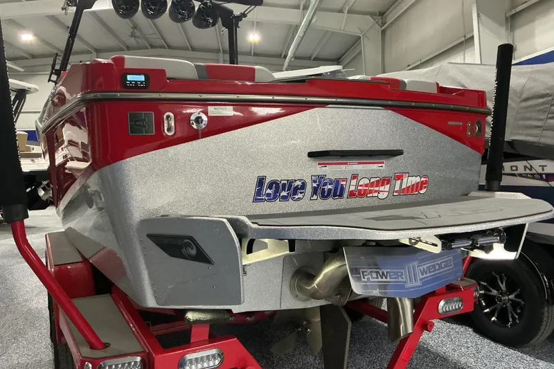 Slide: The Image of Red and silver 2022 Axis T250 boat with "Love You Long Time" text on the back. - 4