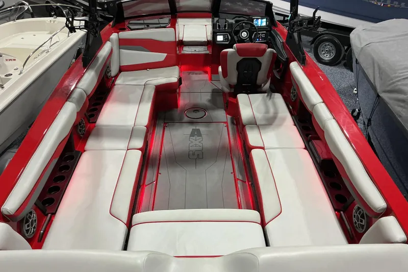 Slide: The Image of 2022 Axis T250 boat interior with red and white seating, modern dashboard, and spacious layout. - 5