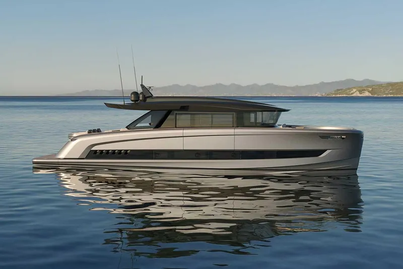 Slide: The Image of Luxurious 2027 Solaris Power 70 GRAND COUPE yacht on serene water with scenic backdrop. - 3