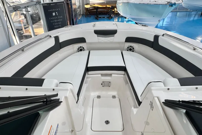 Slide: The Image of 2026 Robalo R277 Dual Console boat interior with spacious seating and modern design. - 4