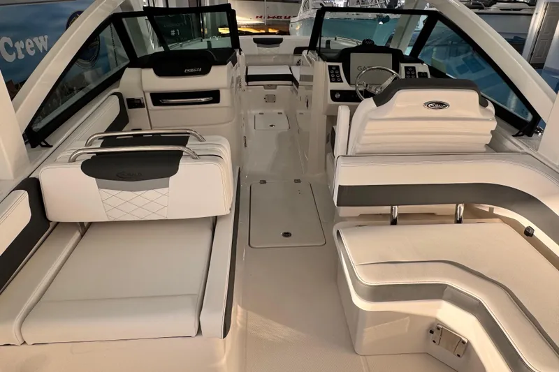 Slide: The Image of 2026 Robalo R277 Dual Console interior with luxurious seating and modern dashboard. - 5