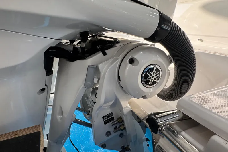 Slide: The Image of Close-up of 2026 Robalo R277 Dual Console boat engine components. - 7