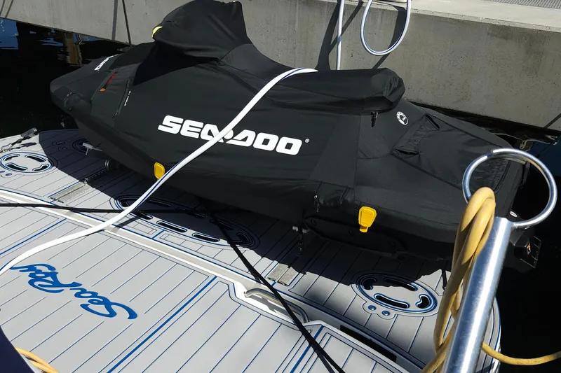 Slide: The Image of Covered Sea-Doo on 2008 Sea Ray 40 Sundancer boat deck at marina. - 10