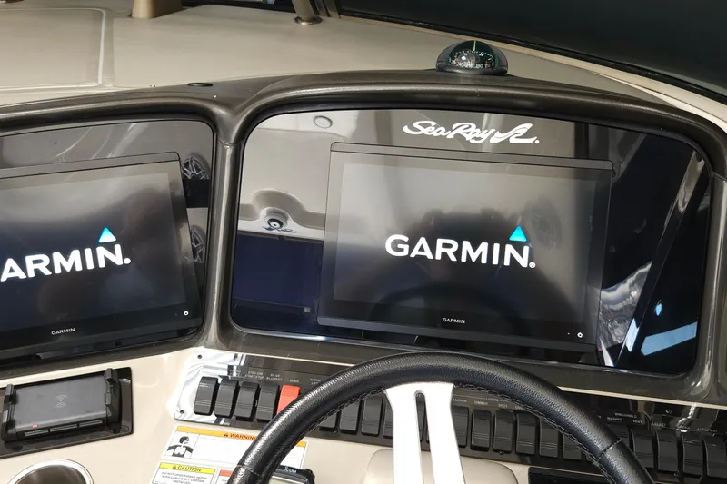 Slide: The Image of Dashboard of 2008 Sea Ray 40 Sundancer with Garmin navigation displays. - 13