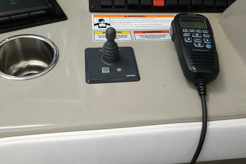 Slide: The Image of Control panel of a 2008 Sea Ray 40 Sundancer with joystick and communication device. - 16