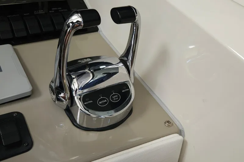 Slide: The Image of Chrome throttle controls on 2008 Sea Ray 40 Sundancer yacht dashboard. - 17