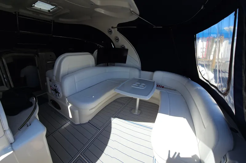 Slide: The Image of 2008 Sea Ray 40 Sundancer interior with white seating and table, featuring modern design. - 22