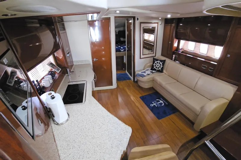 Slide: The Image of Luxurious interior of 2008 Sea Ray 40 Sundancer yacht with modern kitchen and cozy seating area. - 25