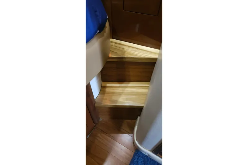 Slide: The Image of Wooden interior stairs of a 2008 Sea Ray 40 Sundancer yacht. - 32