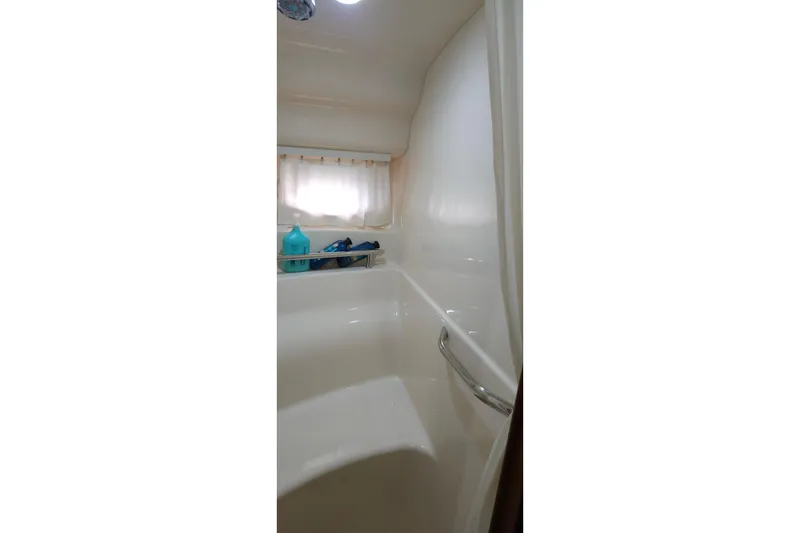 Slide: The Image of Bathroom interior of 2008 Sea Ray 40 Sundancer yacht, featuring a shower and toiletries. - 33