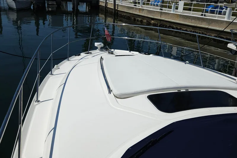 Slide: The Image of 2008 Sea Ray 40 Sundancer yacht bow view at marina dock. - 4