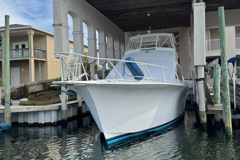 Slide: The Image of Ocean Yachts 56 Super Sport 2002 docked in a marina. - 2