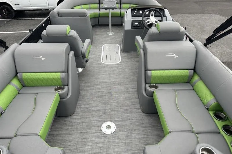 Slide: The Image of 2021 Bennington 22 boat interior with gray and green seating, modern design. - 12