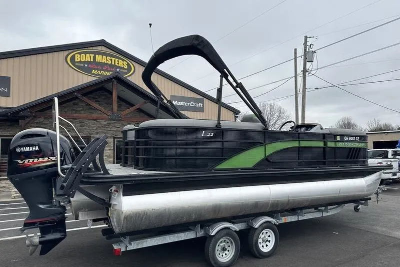 Slide: The Image of 2021 Bennington 22 pontoon boat on trailer outside Boat Masters Marine. - 16