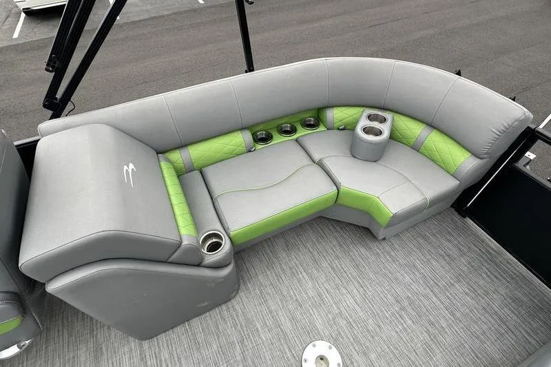 Slide: The Image of Luxurious seating on 2021 Bennington 22 boat with gray and green upholstery, cup holders. - 21