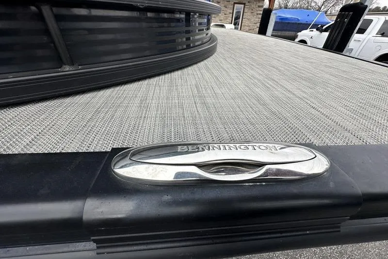 Slide: The Image of 2021 Bennington 22 boat deck with logo, featuring sleek design and textured surface. - 7