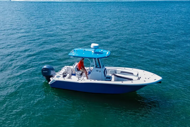 Slide: The Image of 2026 Tidewater 232 LXF boat on open water, featuring a sleek design and Yamaha engine. - 15