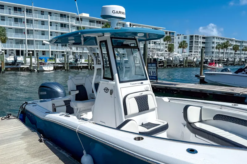 Slide: The Image of 2026 Tidewater 232 LXF boat docked at marina, featuring Yamaha engine and modern design. - 18