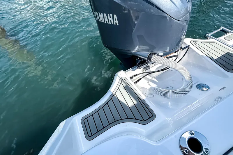 Slide: The Image of 2026 Tidewater 232 LXF boat with Yamaha engine on water. - 21