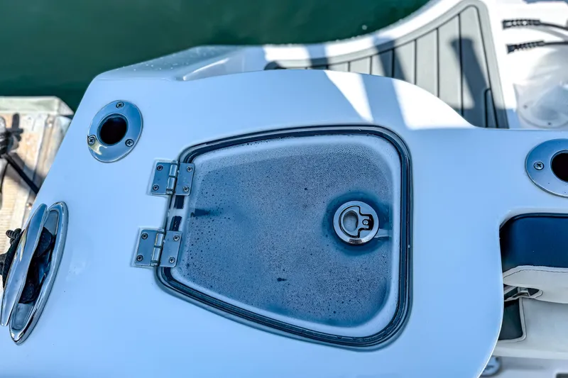 Slide: The Image of 2026 Tidewater 232 LXF boat deck with hatch and stainless steel fittings. - 36