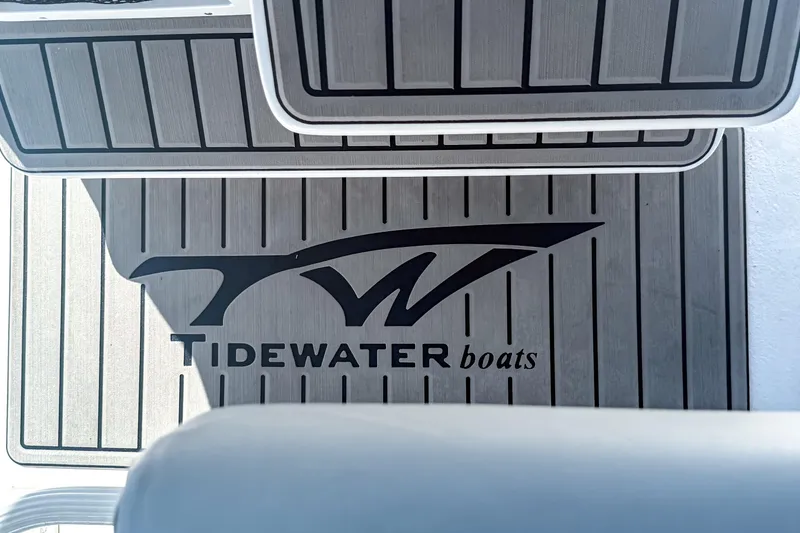 Slide: The Image of 2026 Tidewater 232 LXF boat deck with logo and sleek design. - 38