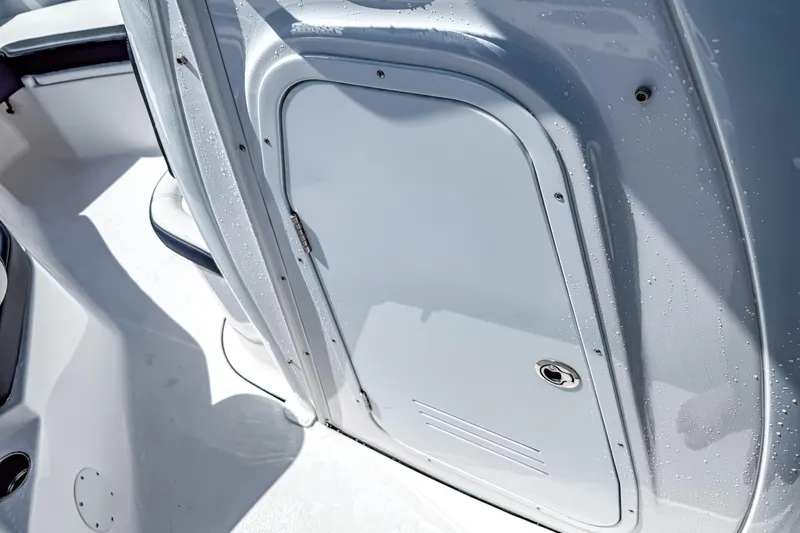 Slide: The Image of 2026 Tidewater 232 LXF boat interior with sleek, wet cabin door design. - 39