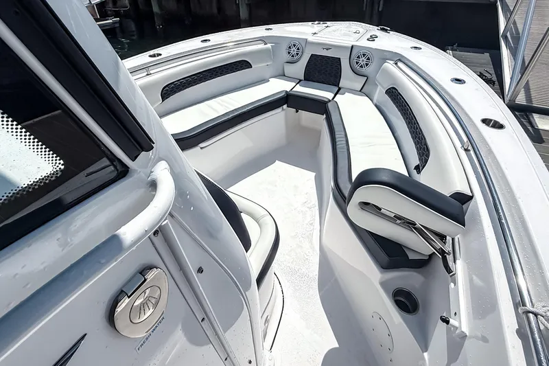 Slide: The Image of 2026 Tidewater 232 LXF boat interior with white seating and modern design. - 41