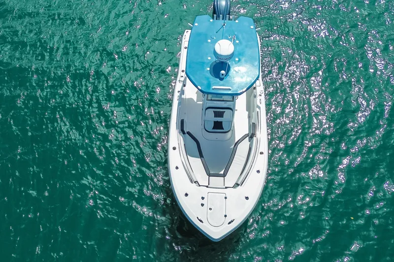 Slide: The Image of Overhead view of 2026 Tidewater 232 LXF boat on clear blue water. - 47