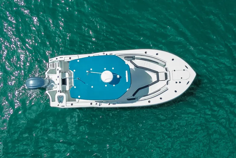 Slide: The Image of Aerial view of 2026 Tidewater 232 LXF boat on turquoise water. - 7