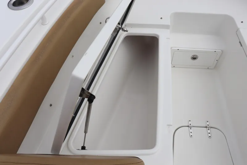Slide: The Image of 2020 Sea Hunt Gamefish 27 Forward Seating storage compartment with open hatch and cushioned seating. - 13