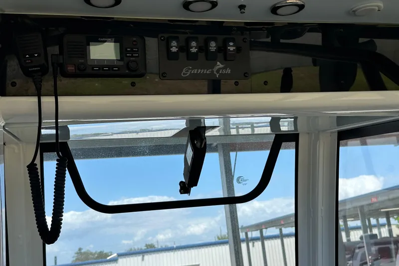 Slide: The Image of 2020 Sea Hunt Gamefish 27 boat interior with Garmin electronics and control panel. - 22