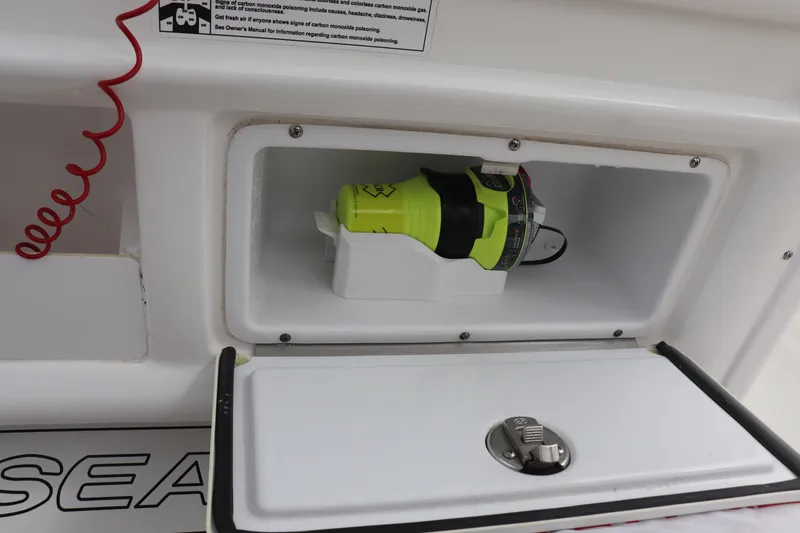 Slide: The Image of Storage compartment on 2020 Sea Hunt Gamefish 27, featuring safety equipment. - 6