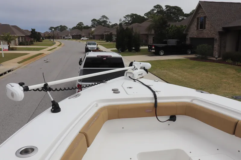 Slide: The Image of 2020 Sea Hunt Gamefish 27 boat on trailer in suburban neighborhood street. - 7