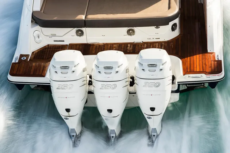 Slide: The Image of 2026 Sea Ray SLX 400 Outboard on calm water under sunny skies. - 11
