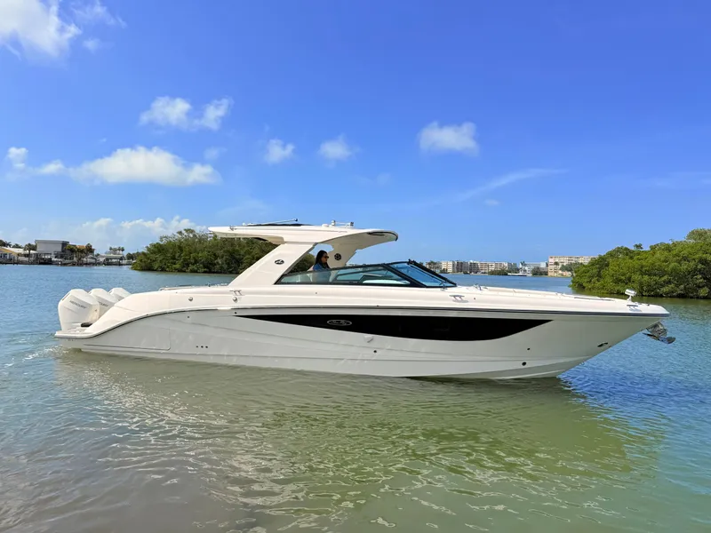 Slide: The Image of 2026 Sea Ray SLX 400 Outboard on calm water under sunny skies. - 15