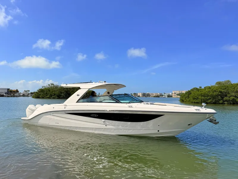 Slide: The Image of 2026 Sea Ray SLX 400 Outboard on calm waters. - 16