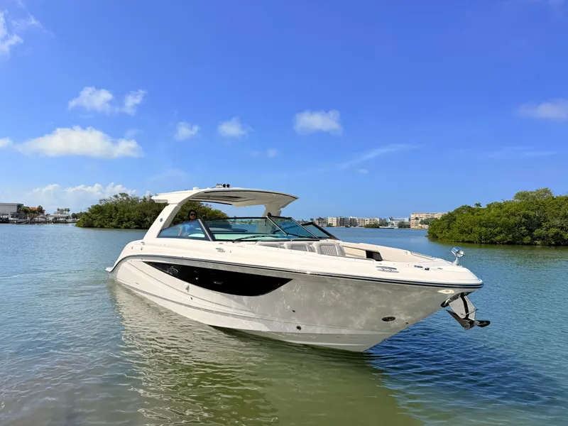 Slide: The Image of 2026 Sea Ray SLX 400 Outboard on calm water under sunny sky. - 17