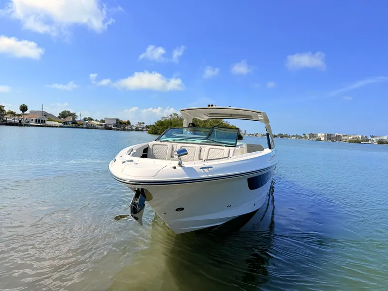 Slide: The Image of 2026 Sea Ray SLX 400 Outboard on calm water under sunny skies. - 20