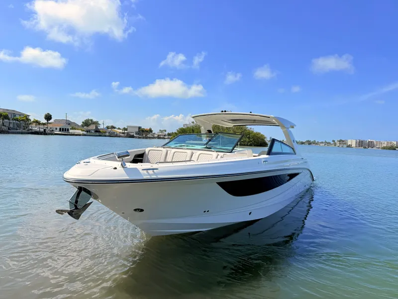 Slide: The Image of 2026 Sea Ray SLX 400 Outboard on calm water under sunny skies. - 21