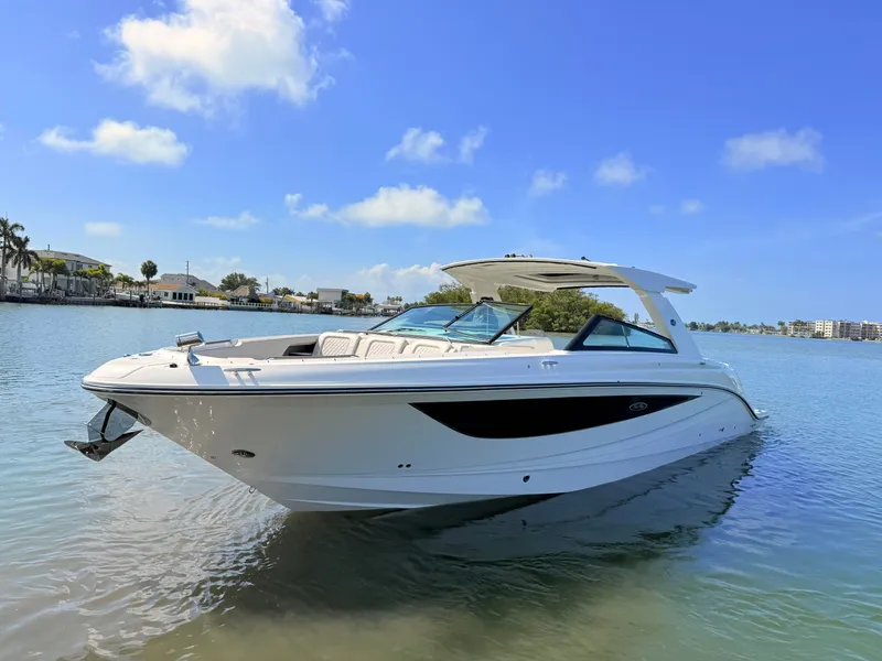 Slide: The Image of 2026 Sea Ray SLX 400 Outboard on calm water under sunny skies. - 22