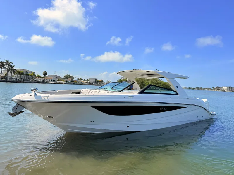 Slide: The Image of 2026 Sea Ray SLX 400 Outboard on calm water under sunny skies. - 23