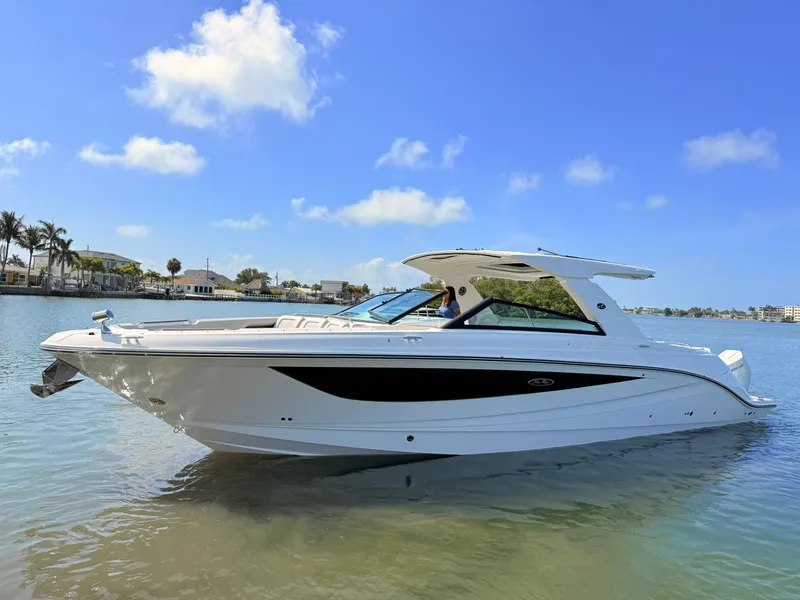 Slide: The Image of 2026 Sea Ray SLX 400 Outboard on calm water under sunny skies. - 24